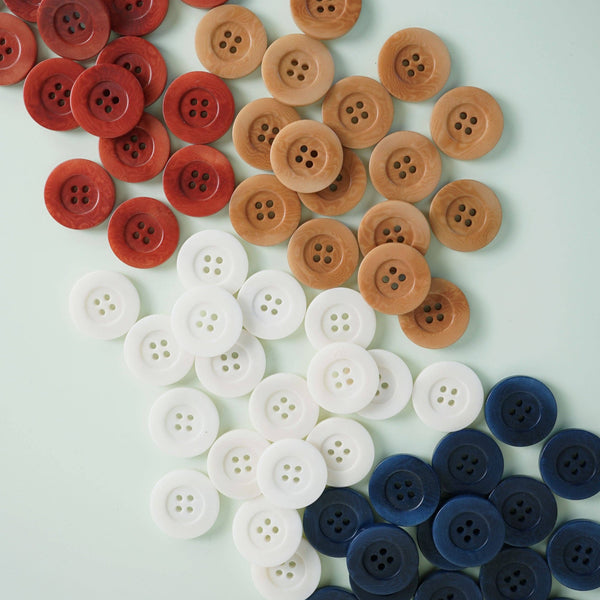 Colorful buttons arranged in a pattern on a light background