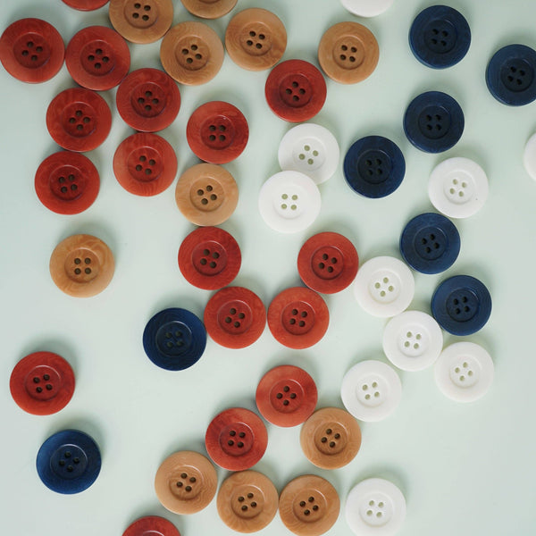 Colorful buttons arranged in a pattern on a light background