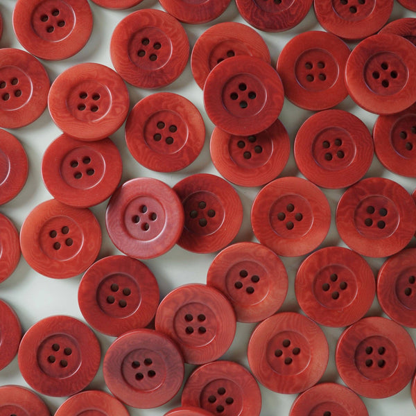 Pattern of red buttons on a white background
