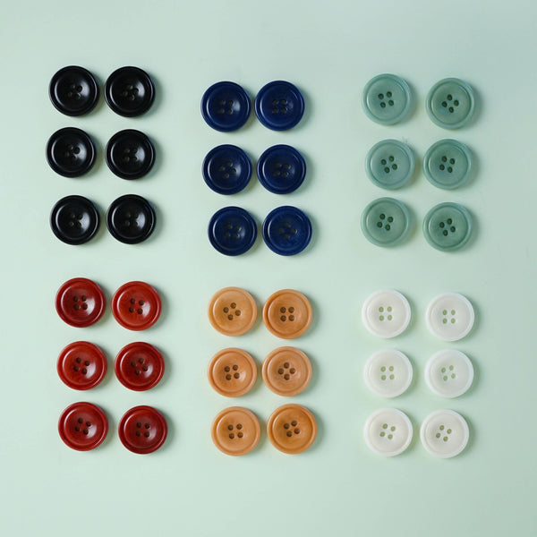 Colorful buttons arranged in a grid on a light green background