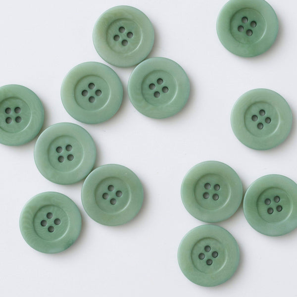 Green buttons on a white background