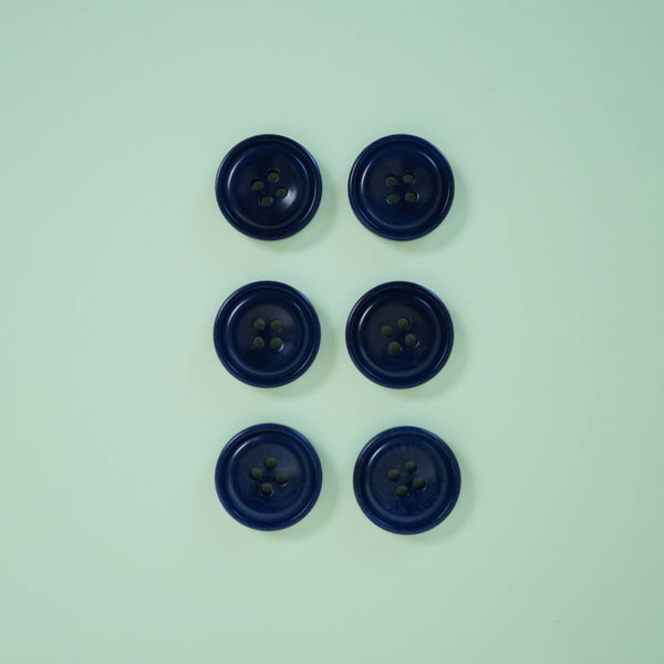 Five blue buttons on a light green background