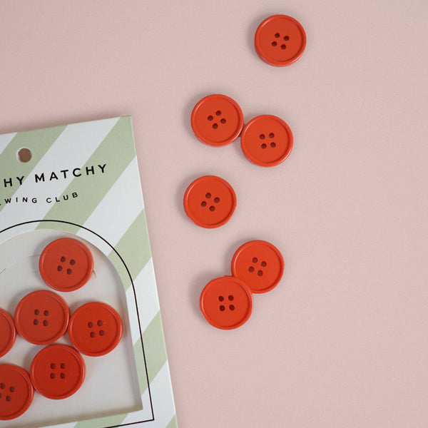 Red buttons on a pink background with a card labeled 'Adorable Buttons' and 'Matchy Matchy Sewing Club'.