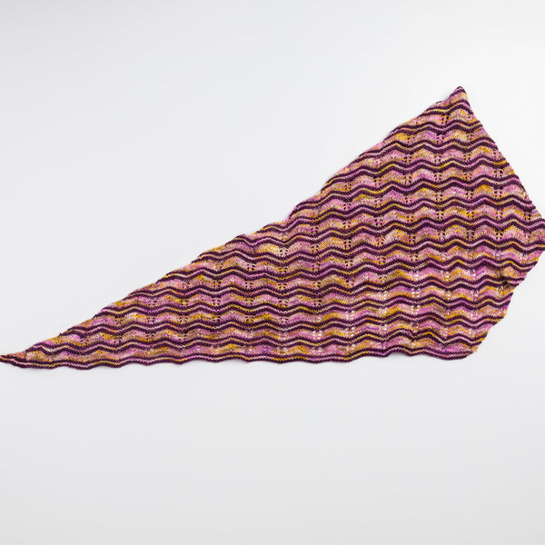 Purple and gold patterned fabric on a white background