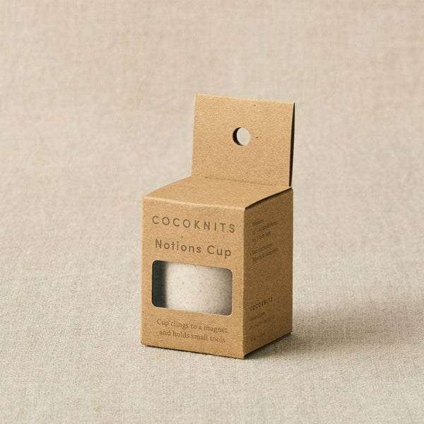 Cocoknits notions cup packaging on a beige background