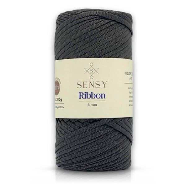 A single roll of dark gray Sensy Ribbon yarn with a cream-colored paper label, shown on a clean white background.
